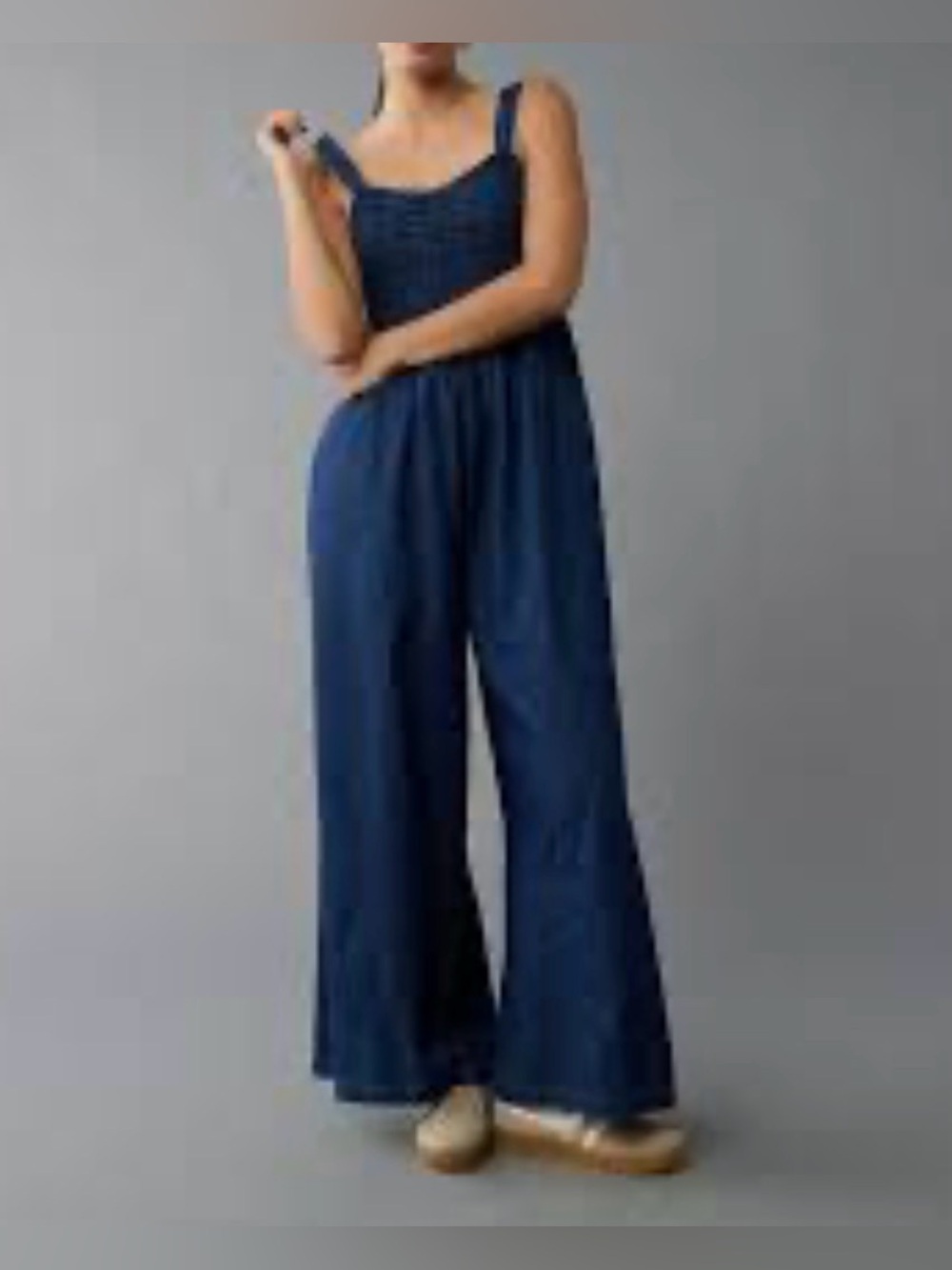 AE Smocked Sweetheart Light denim wide leg jumpsuit with pockets.